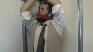 Young businessman tied up and gagged.