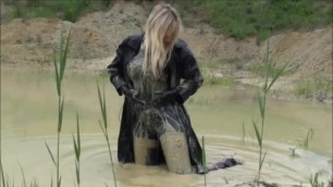 Mud Bath in pvc catsuit, pvc trenchcoat and stiletto booties