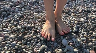 Sexy legs. Walk barefoot on the sea waves.