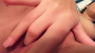 Little girl plays with her little wet cunt