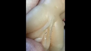 Masturbation with a latex pussy