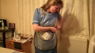 Sexy mature nurse in plastic apron and rubber gloves