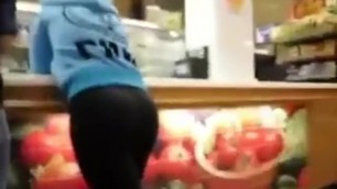 Candid teen in leggings leaning on counter