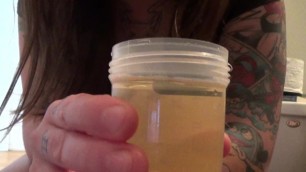Young Elle Pisses In A Cup, Smells It, & Then Dumps It On Her Ass