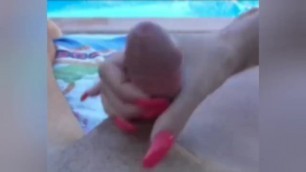 Handjob from a tourist girl in front of a hotel swimming pool