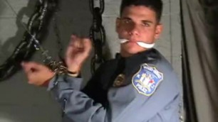 Young cop gagged and chained .