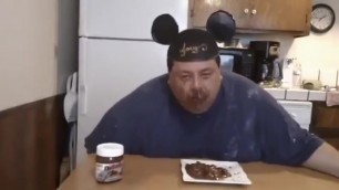 fat man eats brown
