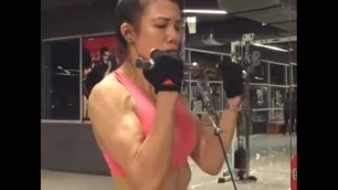 Thai FBB Milf pumping up her biceps 9