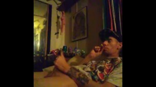 Teasing and stroking my thick stoner uncutcock while smoking a Blunt