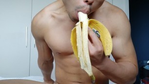 eating a banana - though not quite big enough for this flexing muscle hunk