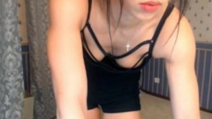 Cam girl working out and flexing biceps and abs