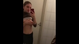 Teen babe flashing in a public restroom