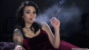 The black-haired girl smokes a cigarette. She thinks black lungs are sexy!