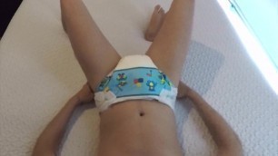 Cute ABDL boy puts on his diaper with booster