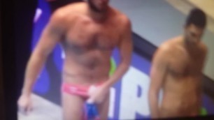 Water polo player grab his bulge