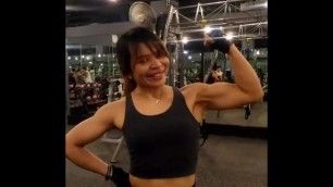 Thai FBB Milf pumping up her biceps 8