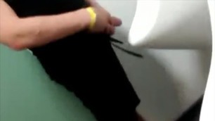 Young drunk guys shows off his massive cock at nightclub urinal