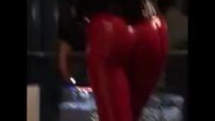 Red leather pants walking in public