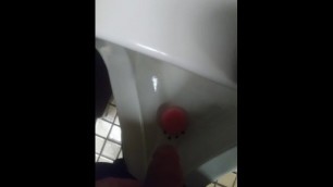 Pissing in urinal at work