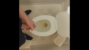 Big cumshot in disgusting hotel bathroom with nasty piss filled toilet