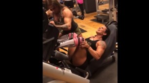 Female bodybuilder prepares her muscle legs for competition