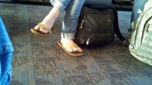 Dangling Rainbow flip flops at the airport