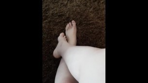 Feet on tufted carpet