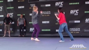 UFC Fan girl kick stomach Holly Holm with feet