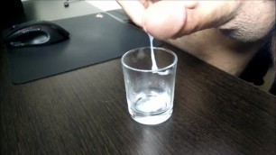 slow motion cumshot in a glass