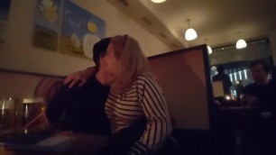 Mother and son flirting inside a restaurant