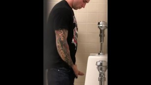 Hot tattoed guy pissing at urinal!
