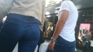 Classy ass in tight jeans parading through the streets