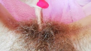 Playing with my big clit hood pulling and stretching hairy bush pussy close