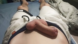 The teen massages his penis with cream while lying on the couch
