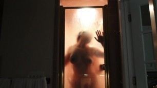 Steaming up the shower and pressing her tits against the glass